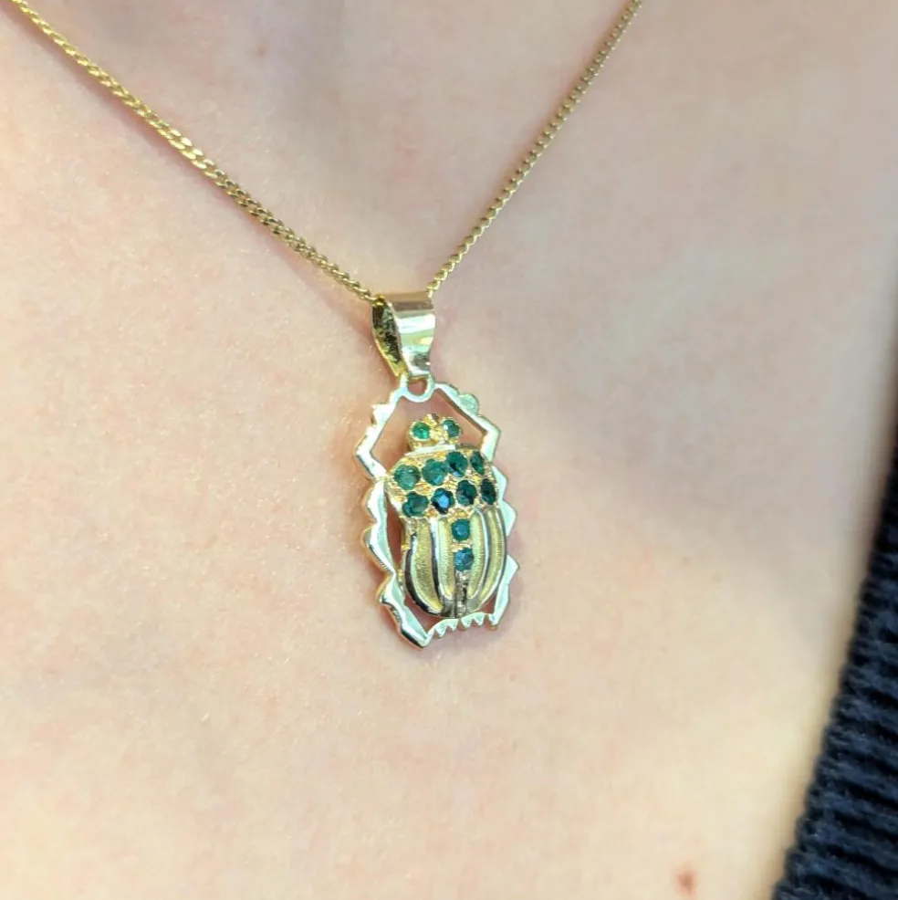 Pendentif animalier en or jaune et émeraudes