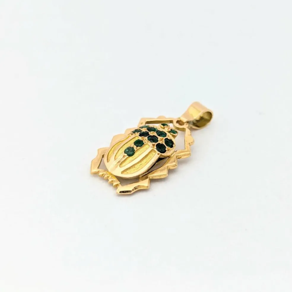 Pendentif animalier en or jaune et émeraudes