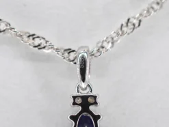 Pendentif en or blanc avec diamants et saphir