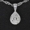 Pendentif en or blanc en forme de goutte avec diamants