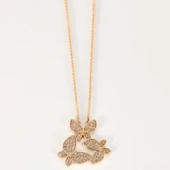 Pendentif or rose, motif papillon