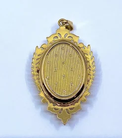 Pendentif porte souvenir ouvrant en or et grenat