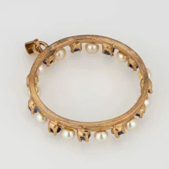 Pendentif vintage en forme de cercle avec perles de culture et saphir