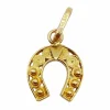 Pendentif vintage or jaune représentant un fer à cheval finement décoré