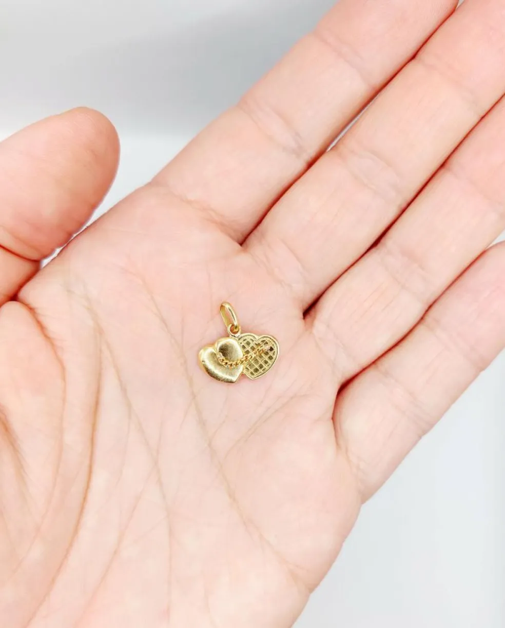 Pendentif vintage or 18k formant deux cœurs accolés reliés par une chaine