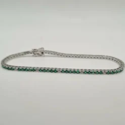 Rivière or blanc sertie de diamants et émeraudes