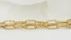 Sautoir maille rectangle texturée en or jaune